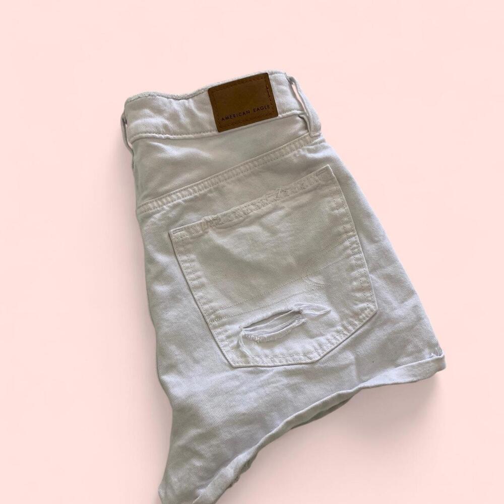 White denim shorts with a distressed look- perfect for summer fits